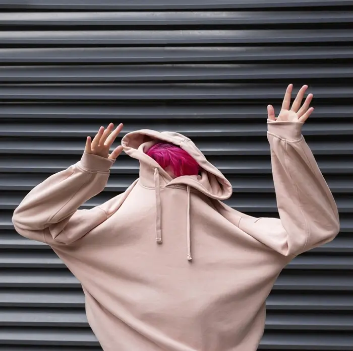 medium shot teen with pink hoodie