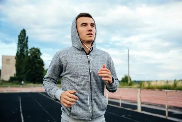 man in hoodie running