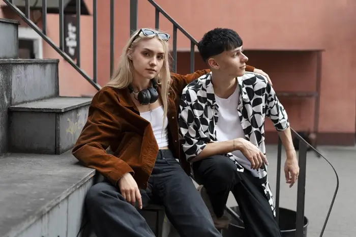 Man in a polyester floral shirt and his girlfriend on the street