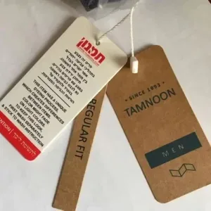 Custom cardboard and printed hang tags from a clothing manufacturer for the Tamnoon brand.