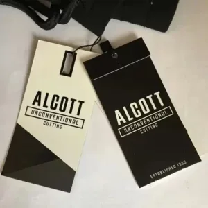 Black and white hang tags for Alcott apparel brand with modern typography and bold layout.