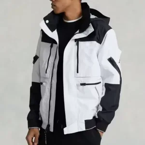 Man wearing a black and white hooded colorblock jacket produced by a men’s clothing manufacturer.